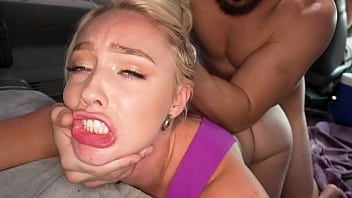 Amateur blonde with small tits giggles while giving a blowjob